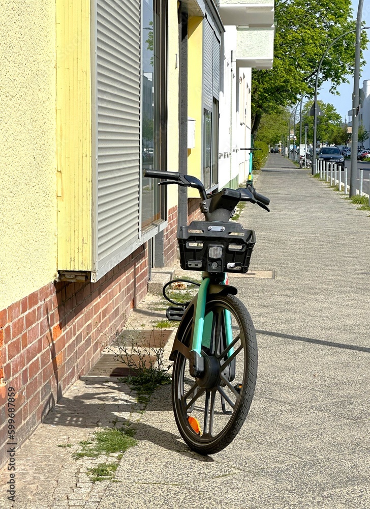 public electric bicycle stands on the sidewalk public electric bicycle stands on the sidewalk