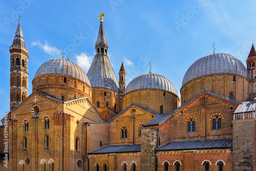 Pontifical Basilica of Saint Anthony of Padua (Basilica of Saint Anthony of Padua) in Padova, Veneto region, Italy. Side view of the walls and domes on a bright sunny day photo