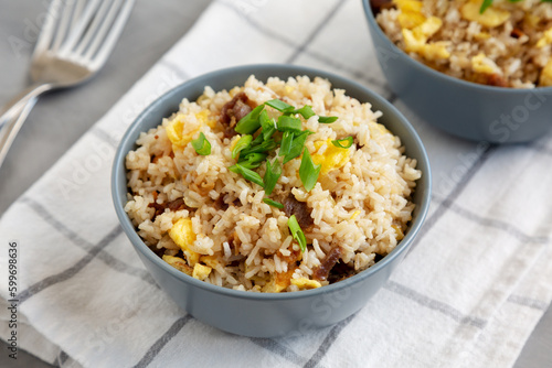 Homemade Fried Rice with Bacon and Egg in a Bowl, side view.