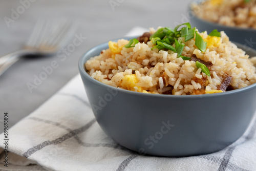 Homemade Fried Rice with Bacon and Egg in a Bowl, side view.