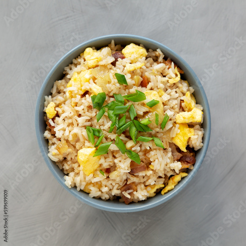 Homemade Fried Rice with Bacon and Egg in a Bowl, top view. Flat lay, overhead, from above.