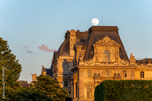 Moon over old building
