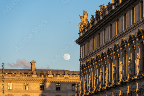 Moon over old building