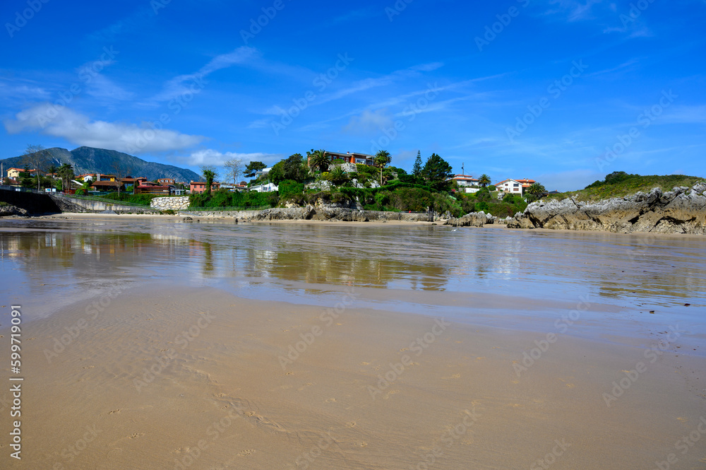 View on Playa de Palombina Las Camaras in Celorio, Green coast of Asturias, North Spain with sandy beaches, cliffs, hidden caves, green fields and mountains. View on Playa de Palombina Las Camaras in Celorio, Green coast of Asturias, North Spain with sandy beaches, cliffs, hidden caves, green fields and mountains.