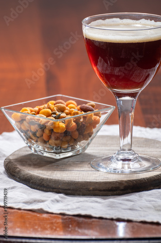 Glass of Belgian abbey brown beer in bar