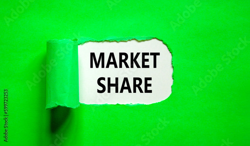 Market share symbol. Concept words Market share on beautiful white paper. Beautiful green table green background. Business and Market share concept. Copy space.