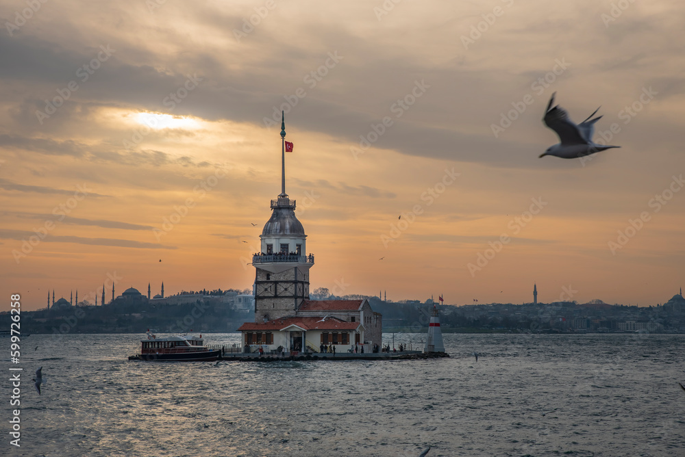 Fototapeta premium Maiden's Tower, built on an island in the Bosphorus, one of the architectural symbols of Istanbul and Turkey, and its photographs taken at sunset in different lights and colors