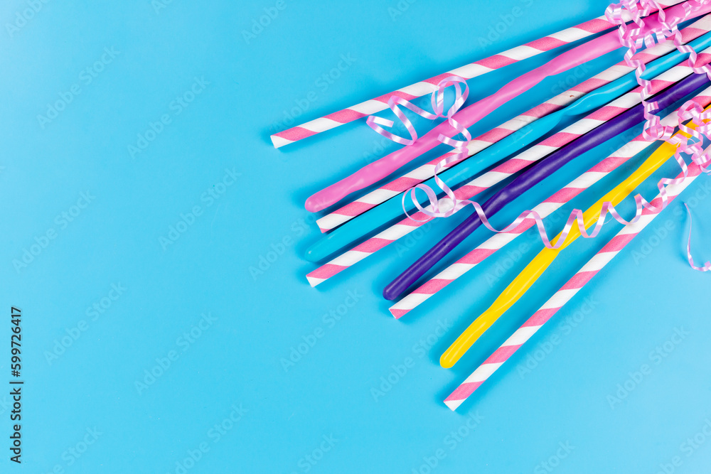 a top view colorful straws long sticky isolated on the blue background drink juice cold color a top view colorful straws long sticky isolated on the blue background drink juice cold color
