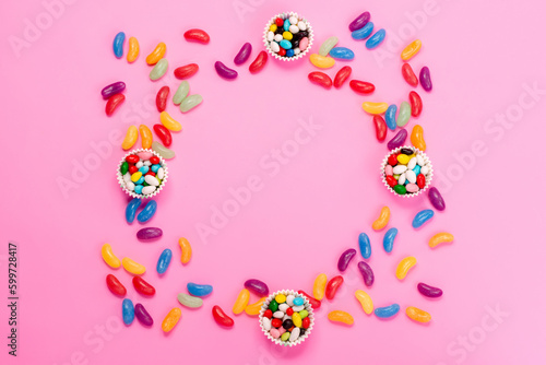 a top view marmalades and candies colored sweet on the pink desk sugar sweet confectionery candy