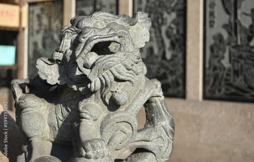 Traditional style guardian lion outside a Chinese temple