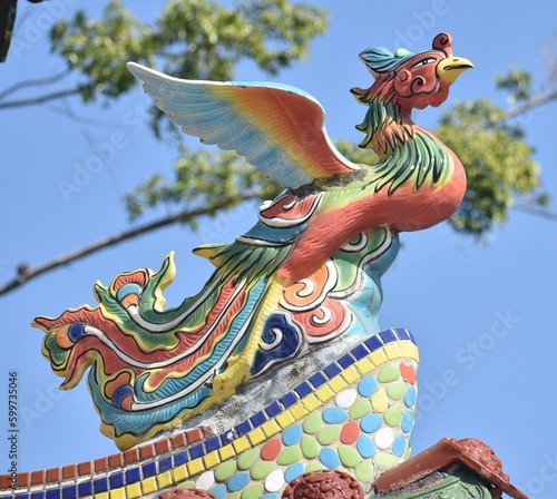Pretty phoenix statue on top of a Chinese temple in Taiwan