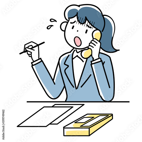 困った表情で電話対応するビジネスウーマンの上半身