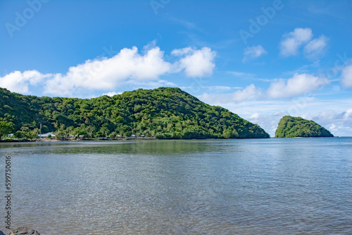 Lagoon, hills, island and rural small village, Masefau, American Samoa