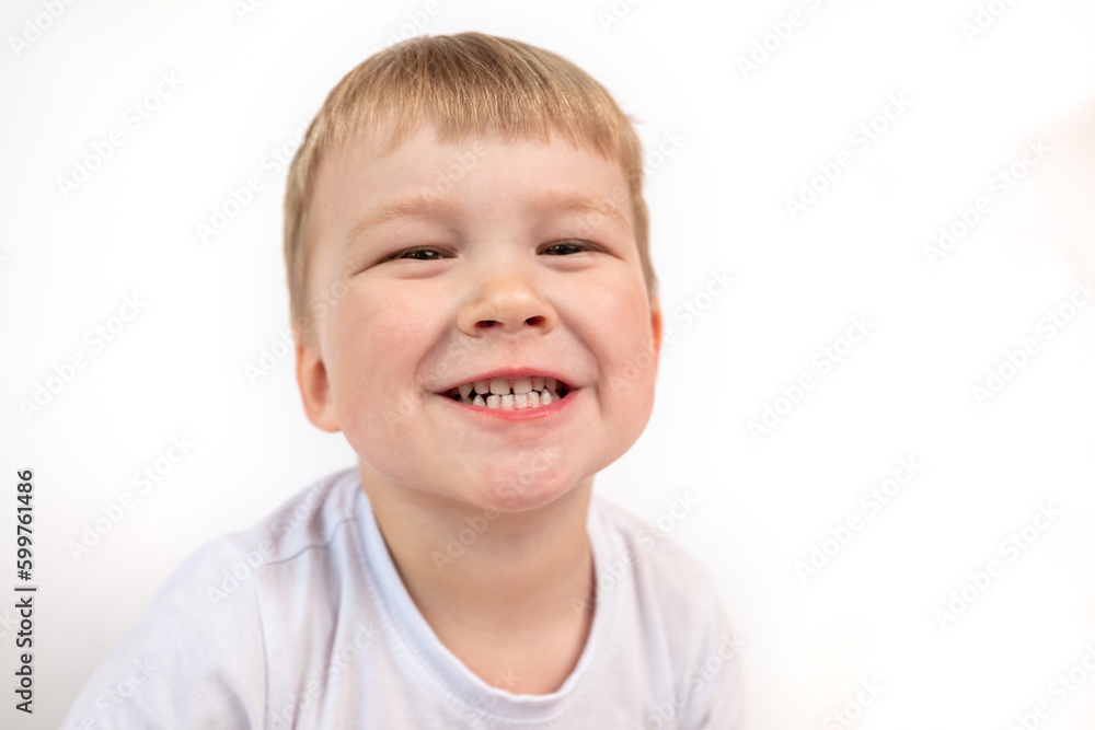Child boy shows his baby white healthy teeth close-up. The concept of oral hygiene, healthy teeth Child boy shows his baby white healthy teeth close-up. The concept of oral hygiene, healthy teeth