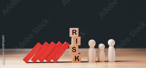 Business Risk, Crisis Management Concept. Hand stopping wooden domino protect business crisis effect. Concept of Business Crisis, Risk, Management, Assessment, Insurance, Security, Financial, Economic