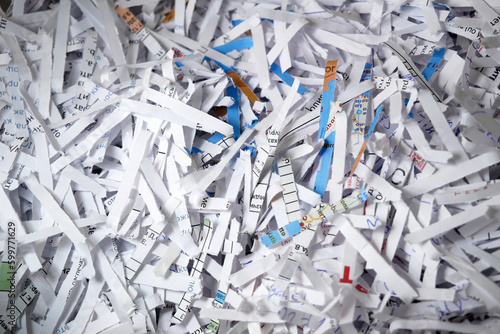 Big stack of shredded documents to protect confidential information, safety is first concept, background, top view,