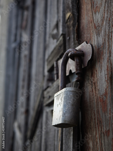 old rusty padlock, metal lock on a wooden door, rusty lock on an old door.