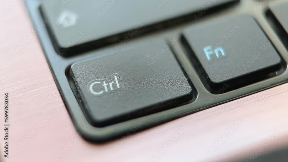 Pressing the Ctrl key on a laptop keyboard.Macro shot.Looped video. Pressing the Ctrl key on a laptop keyboard.Macro shot.Looped video.