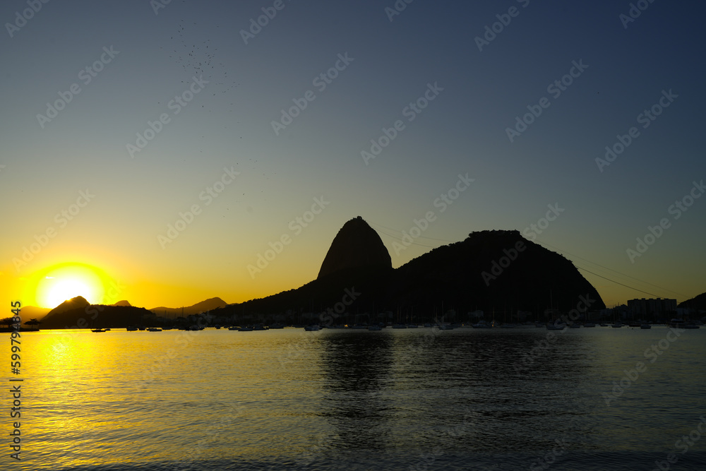 Golden Sunrise over Guanabara Bay in Rio de Janeiro with Sugarloaf Mountain in the Horizon