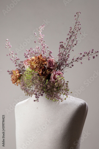 mannequin as a vase with dried flowers