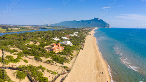 Aerial view of the seafront of Sabaudia, Italy. The beach is almost empty. In the background the Circeo promontory.