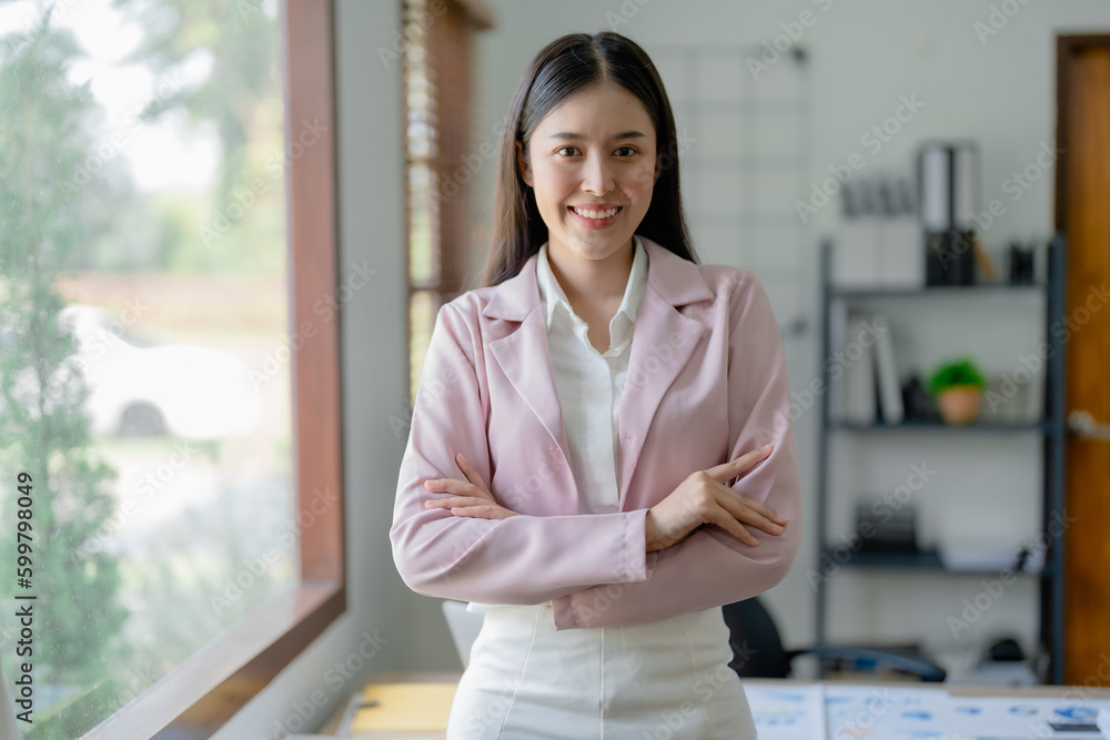 Excited businesswoman using computer laptop while in office, business concepts. Excited businesswoman using computer laptop while in office, business concepts.