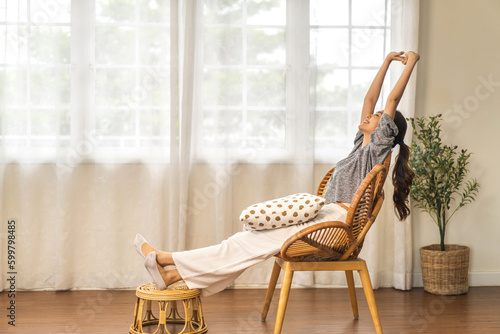 Portrait of smiling beauty pretty asian woman comfortable fresh healthy smile happy and relax in pajamas white clothes, happy calm, resting, breathing fresh air.Girl felling wellbeing enjoy at home photo