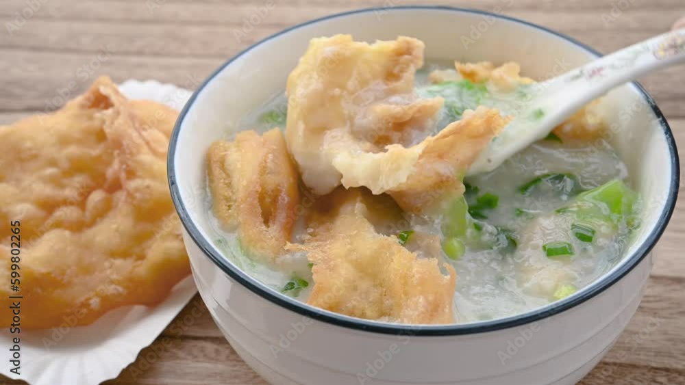 fish porridge with deep-fried Chinese donuts at horizontal composition fish porridge with deep-fried Chinese donuts at horizontal composition