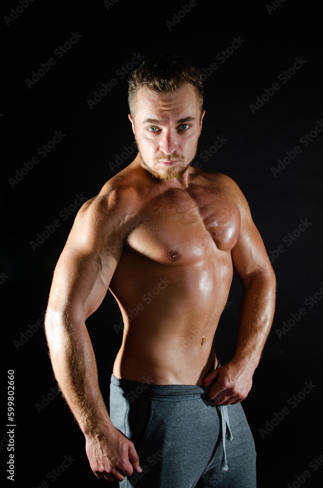 Fitness and healthy lifestyle. Young attractive man with a beautiful body.