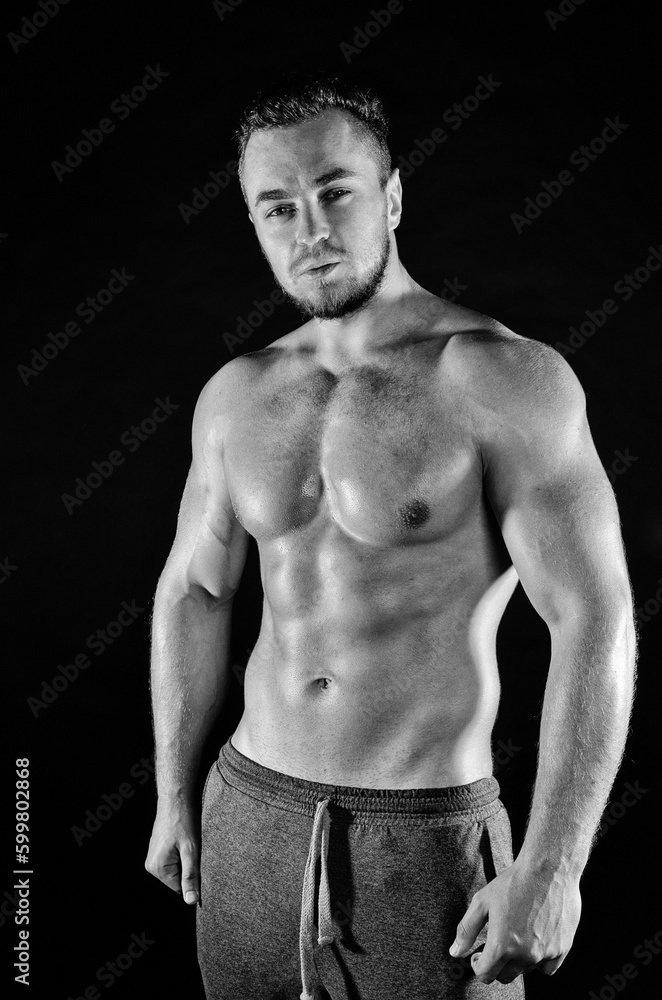 Fitness and healthy lifestyle. Young attractive man with a beautiful body.