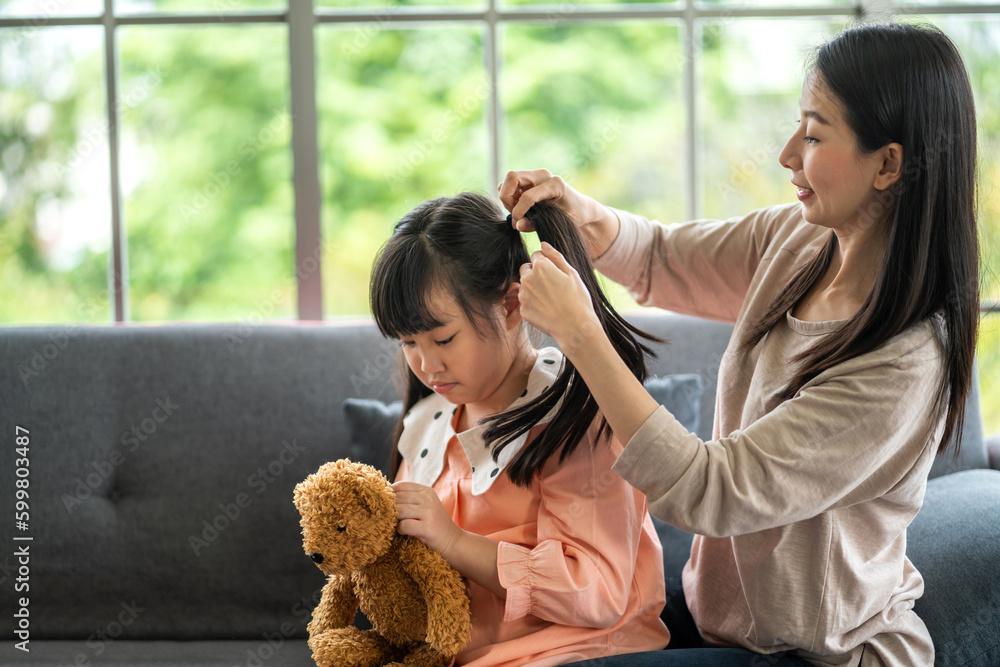 Portrait of enjoy happy love asian family mature mother and girl daughter smiling play and having fun together, mom, mother day, care, kid, child.happy family in moments good time at home Portrait of enjoy happy love asian family mature mother and girl daughter smiling play and having fun together, mom, mother day, care, kid, child.happy family in moments good time at home