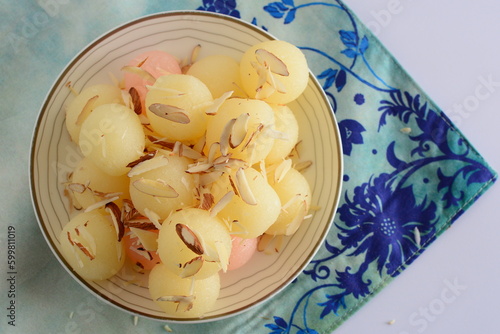 Pink and white cham cham with some almonds on it with cloth on background photo