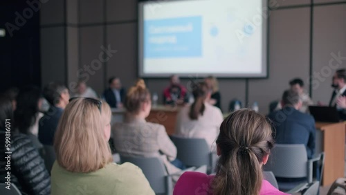 Wallpaper Mural People attending symposium sitting in conference hall Torontodigital.ca