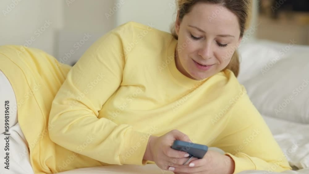 Woman shopping online with phone, checking email on smartphone, online language practice Woman shopping online with phone, checking email on smartphone, online language practice