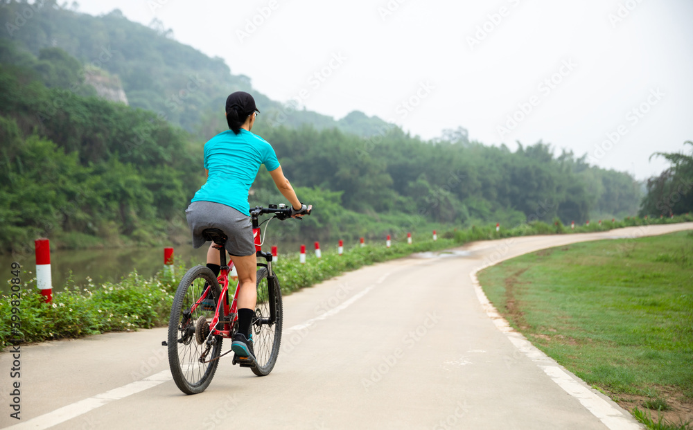 Fototapeta premium Riding bike in spring forest