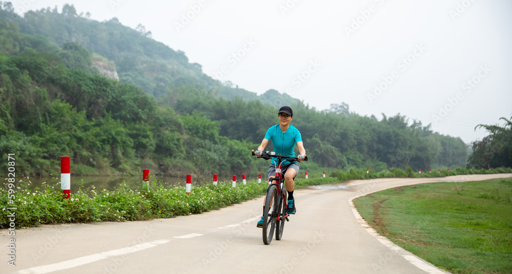 Fototapeta premium Riding bike in spring forest