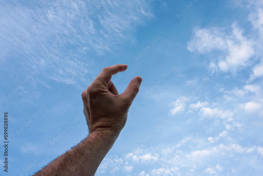 hand up gesturing in the blue sky, feelings and emotions hand up gesturing in the blue sky, feelings and emotions