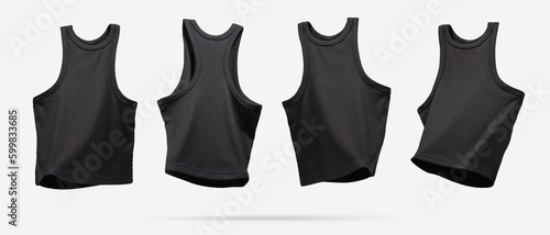 Summer Women's Clothing. Ribbed black tank top flying from different sides on light gray background. Female comfortable natural cotton cloth. Creative template for design Mock up. Copy space photo