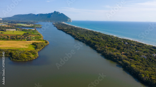 Aerial view of the lake and seafront of Sabaudia, Italy. In the background the Circeo promontory.