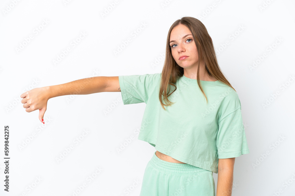 Young Lithuanian woman isolated on white background showing thumb down with negative expression Young Lithuanian woman isolated on white background showing thumb down with negative expression