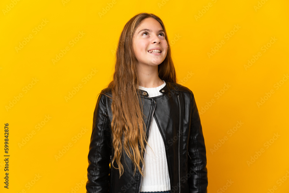 Child over isolated yellow background laughing Child over isolated yellow background laughing