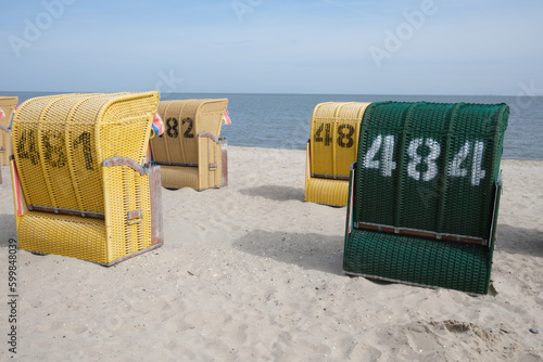 yellow beach chairs on sandy beach