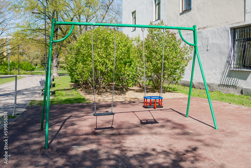 Toddler swing set in side of the park