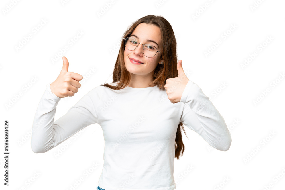 Teenager girl over isolated chroma key background giving a thumbs up gesture Teenager girl over isolated chroma key background giving a thumbs up gesture