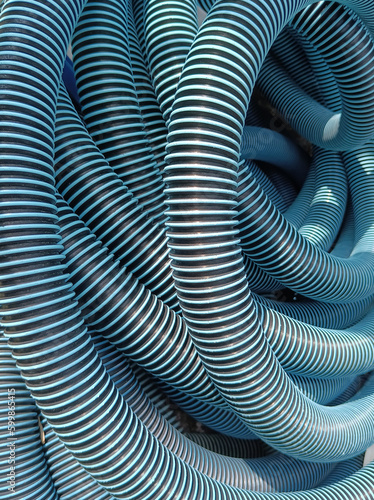 a plastic hose reel with blue black pattern