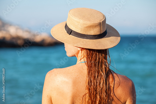 Sun Protection. Female Tanned Shoulder. Skin Care. Girl Using Sunscreen to Skin.    © perminoffa
