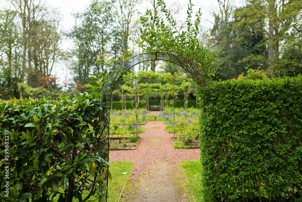 Shallow focus us of the privet entrance to a secret garden, set in the grounds of a large English private house. Shallow focus us of the privet entrance to a secret garden, set in the grounds of a large English private house.