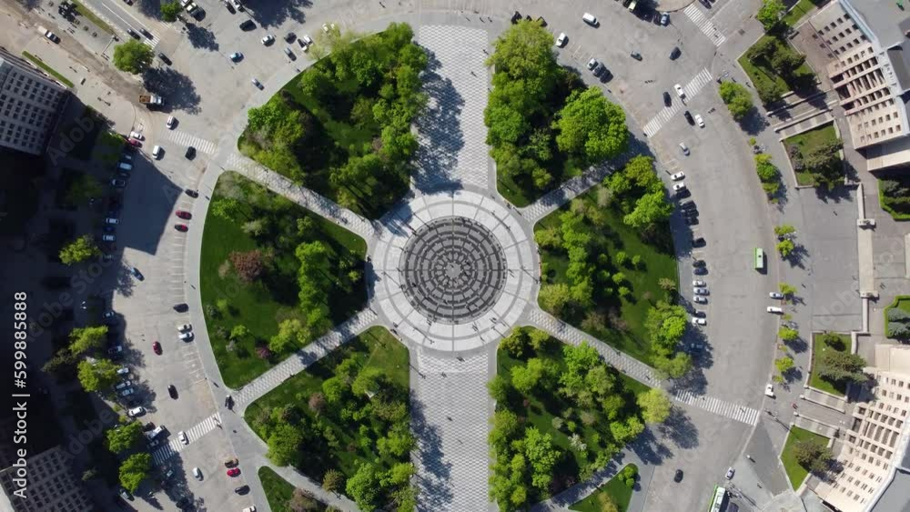 Aerial fly up view on Freedom Svobody Square central fountain circle with green park and streets look down. Center of Kharkiv city, Ukraine Aerial fly up view on Freedom Svobody Square central fountain circle with green park and streets look down. Center of Kharkiv city, Ukraine