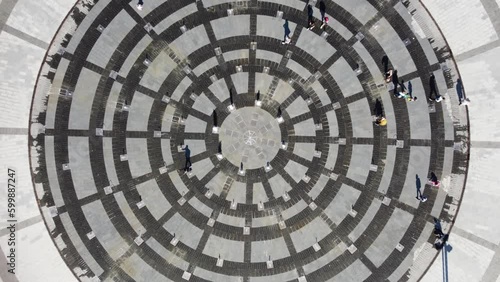 Aerial spiral timelapse view, Freedom Svobody Square central fountain circle look down. Recreation park in center of Kharkiv, Ukraine
