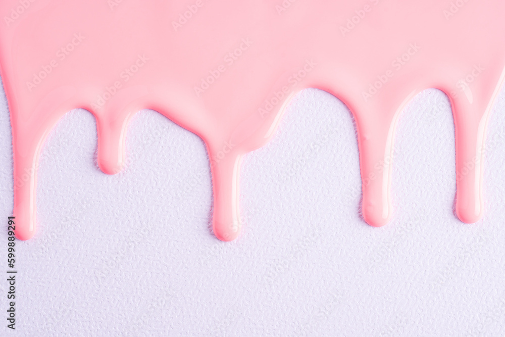 Pink liquid drops of paint color flow down on white canvas. Abstract art. Light pink paint dripping on the white wall with copy space.. Pink liquid drops of paint color flow down on white canvas. Abstract art. Light pink paint dripping on the white wall with copy space..